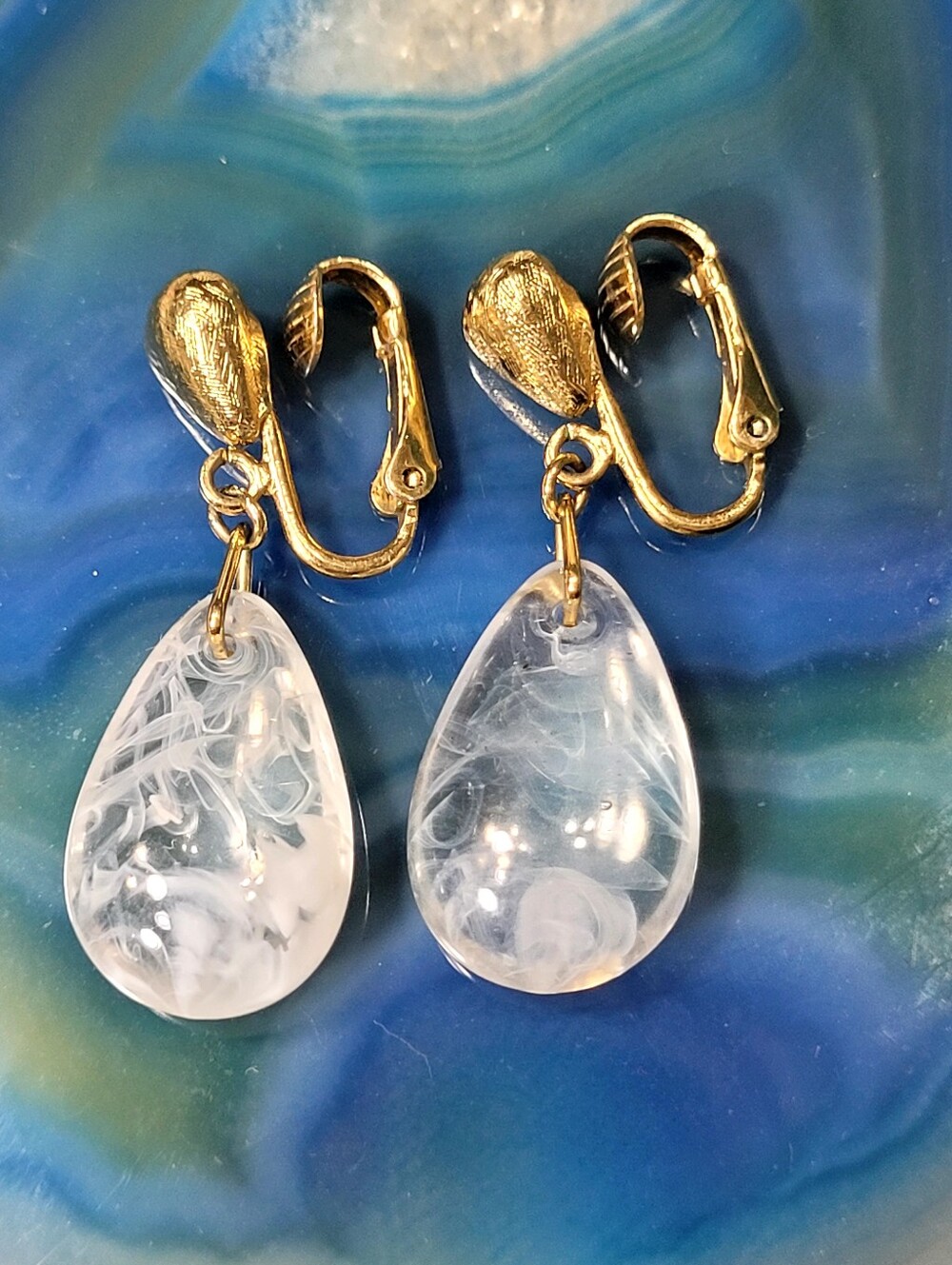 Gold Clip-On Earrings with Clear Teardrop Dangles